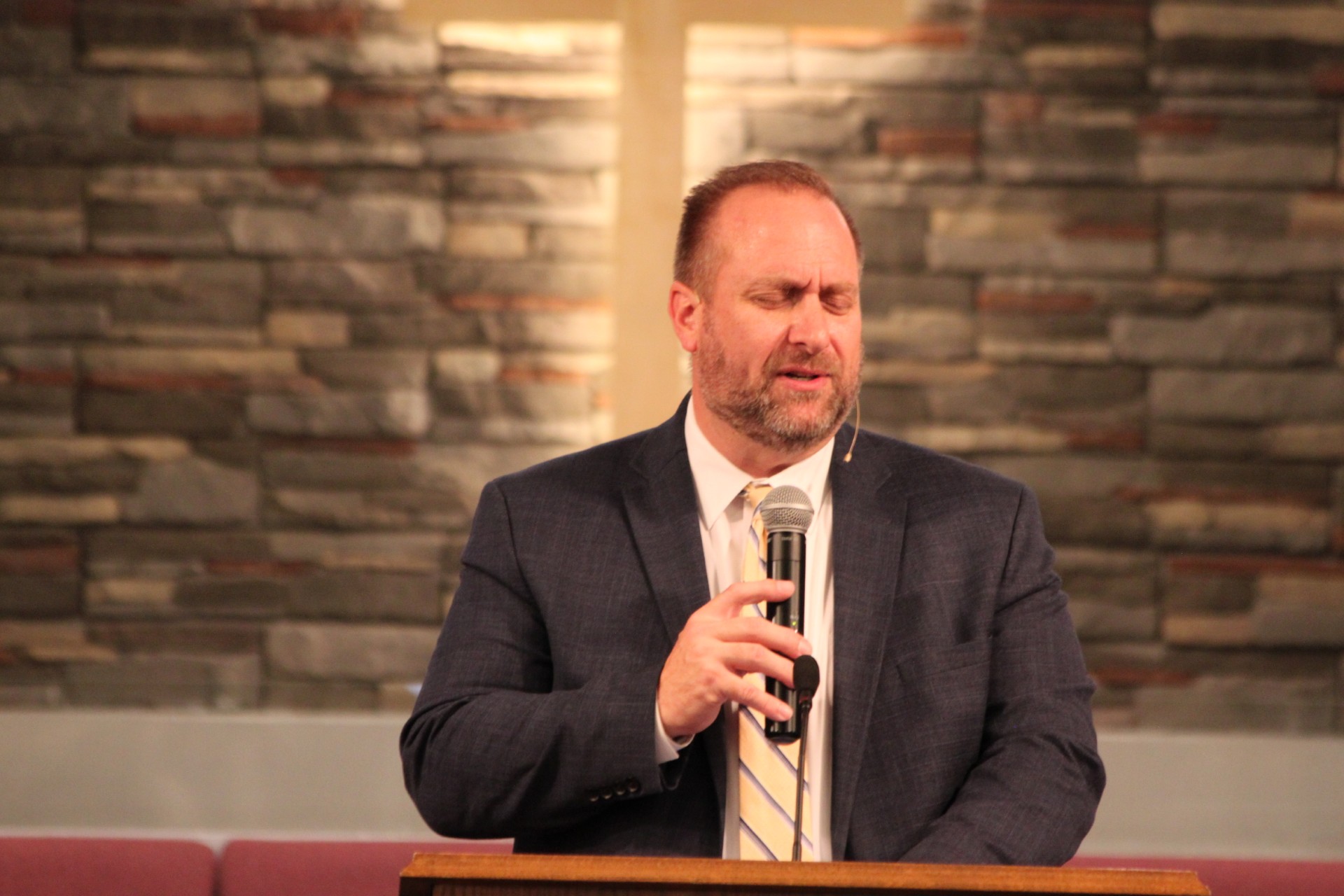Photo of the Pastor delivering a clear, engaging, Bible-preaching message, or a small group connecting in a friendly atmosphere. 